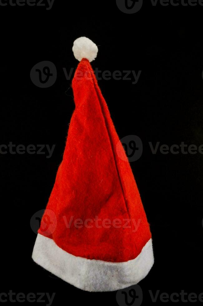 a santa hat on a black background photo