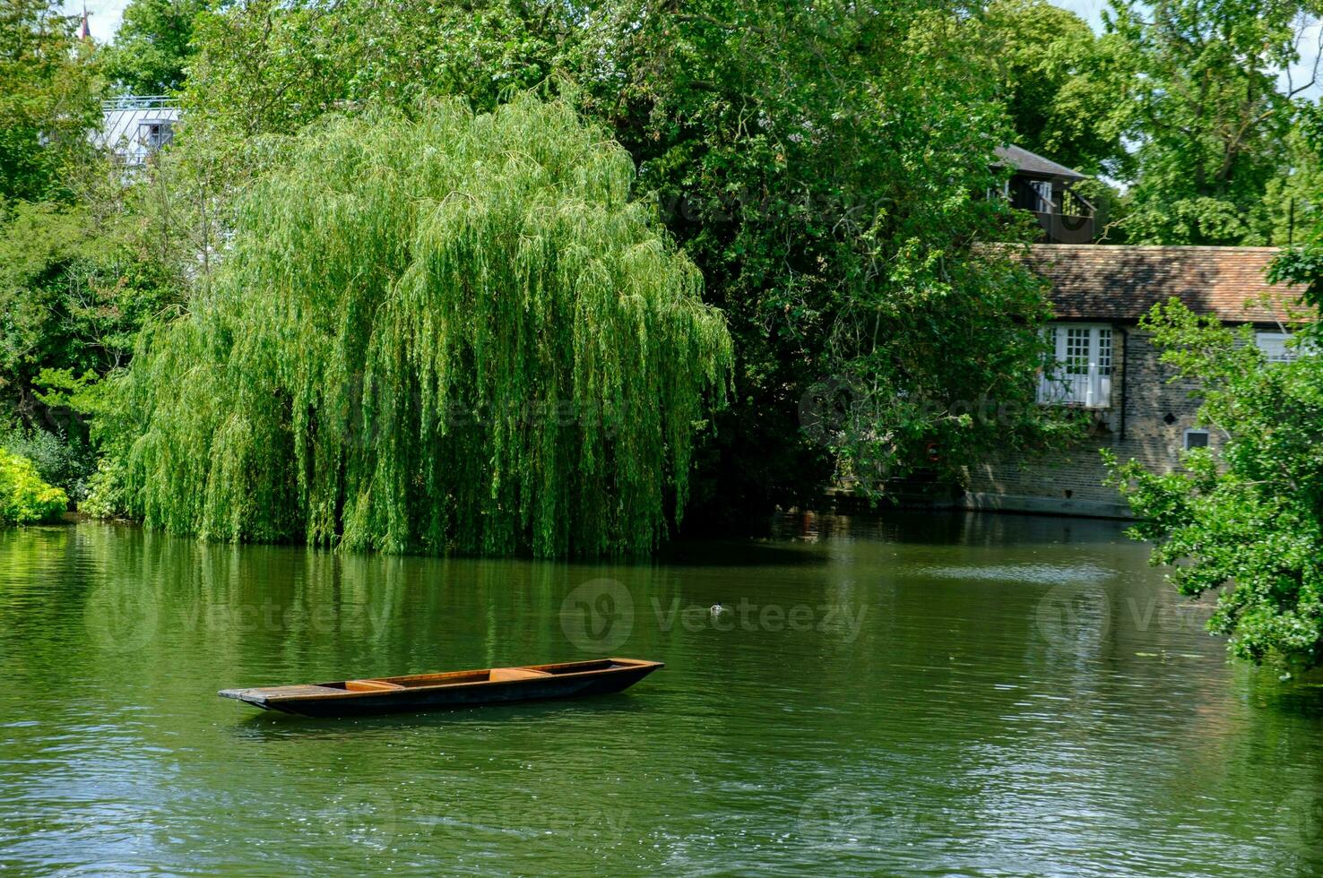 A punting boat drifts by itself on River Cam in Cambridge, England. photo