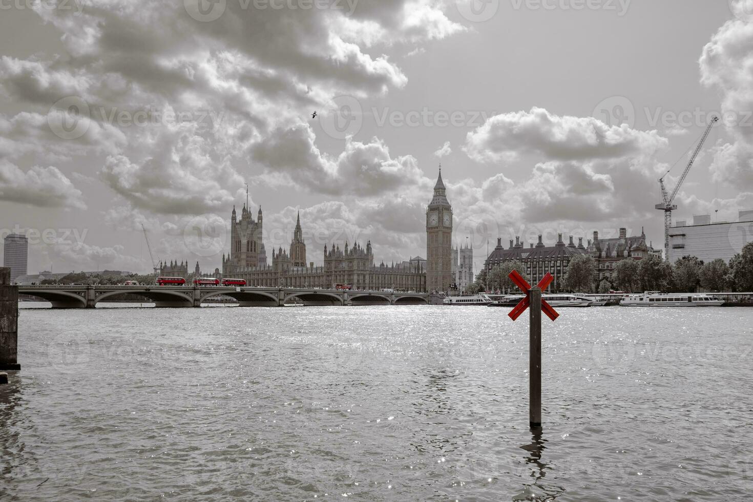 River Thames with buildings of Parliament with Big Ben tower in the distance- London UK. photo