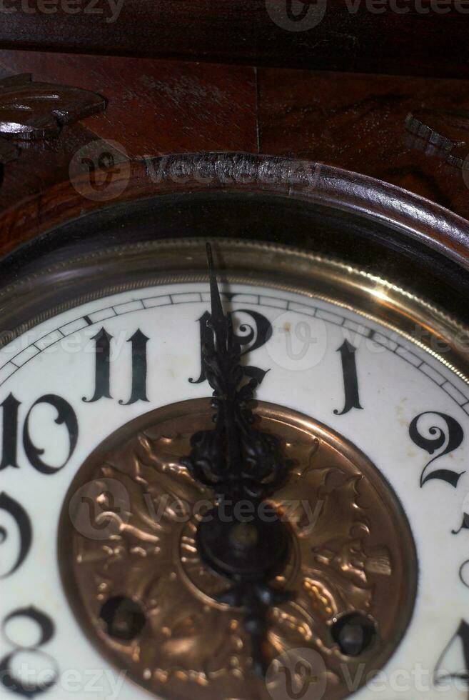 wooden old historic clock shows midnight photo