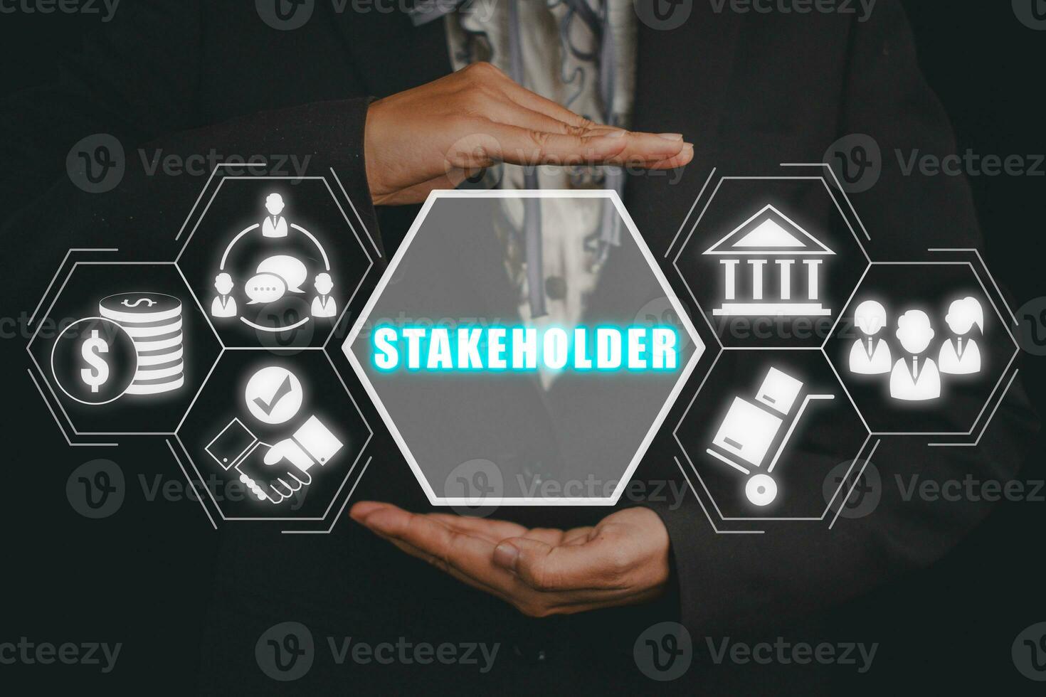 Stakeholder concept, Business woman hand holding stakeholder icon on virtual screen. photo