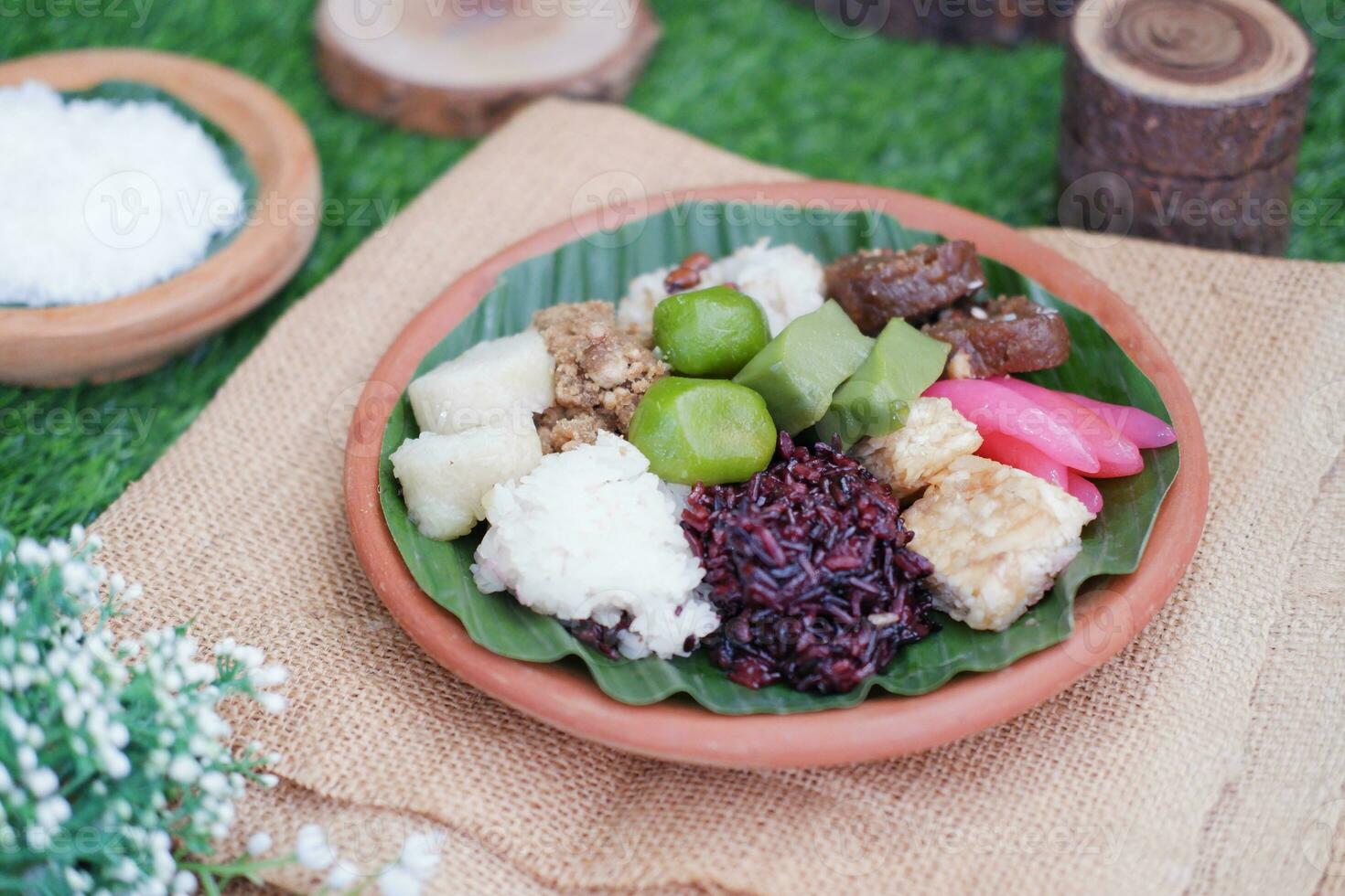 Jenang Madura is a typical Indonesian food that consists of black sticky rice, porridge marrow, jenang grendul and red pearls that were given palm sugar and coconut milk photo