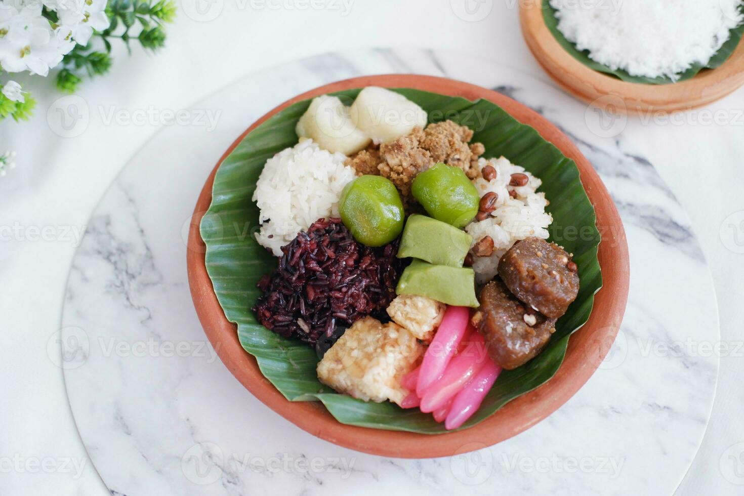 Jenang Madura is a typical Indonesian food that consists of black sticky rice, porridge marrow, jenang grendul and red pearls that were given palm sugar and coconut milk photo