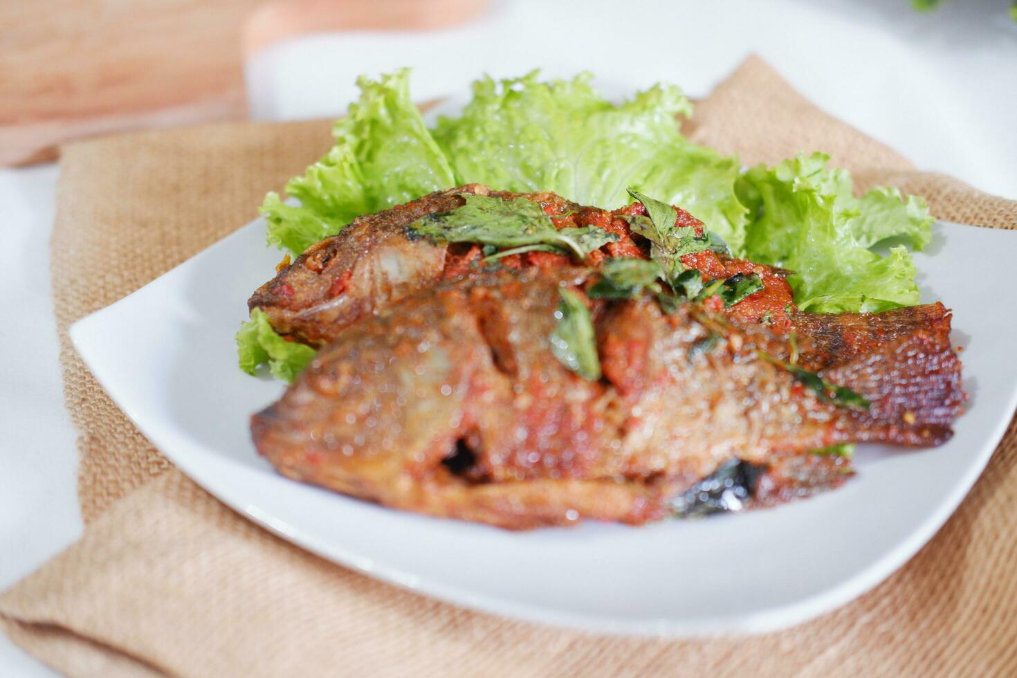Fried mackerel fish with chili sauce photo