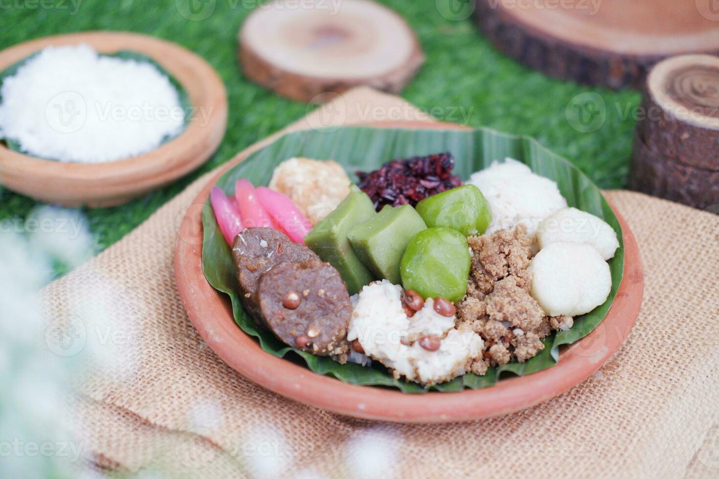 Jenang Madura is a typical Indonesian food that consists of black sticky rice, porridge marrow, jenang grendul and red pearls that were given palm sugar and coconut milk photo