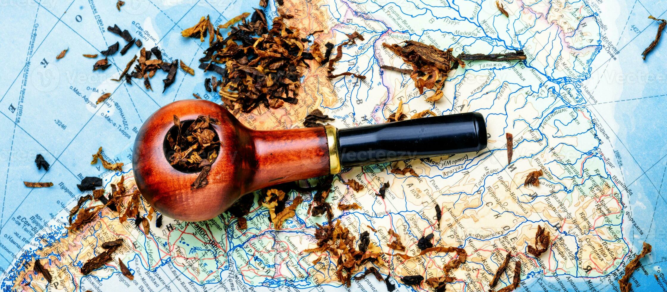 Tobacco pipe on the map photo