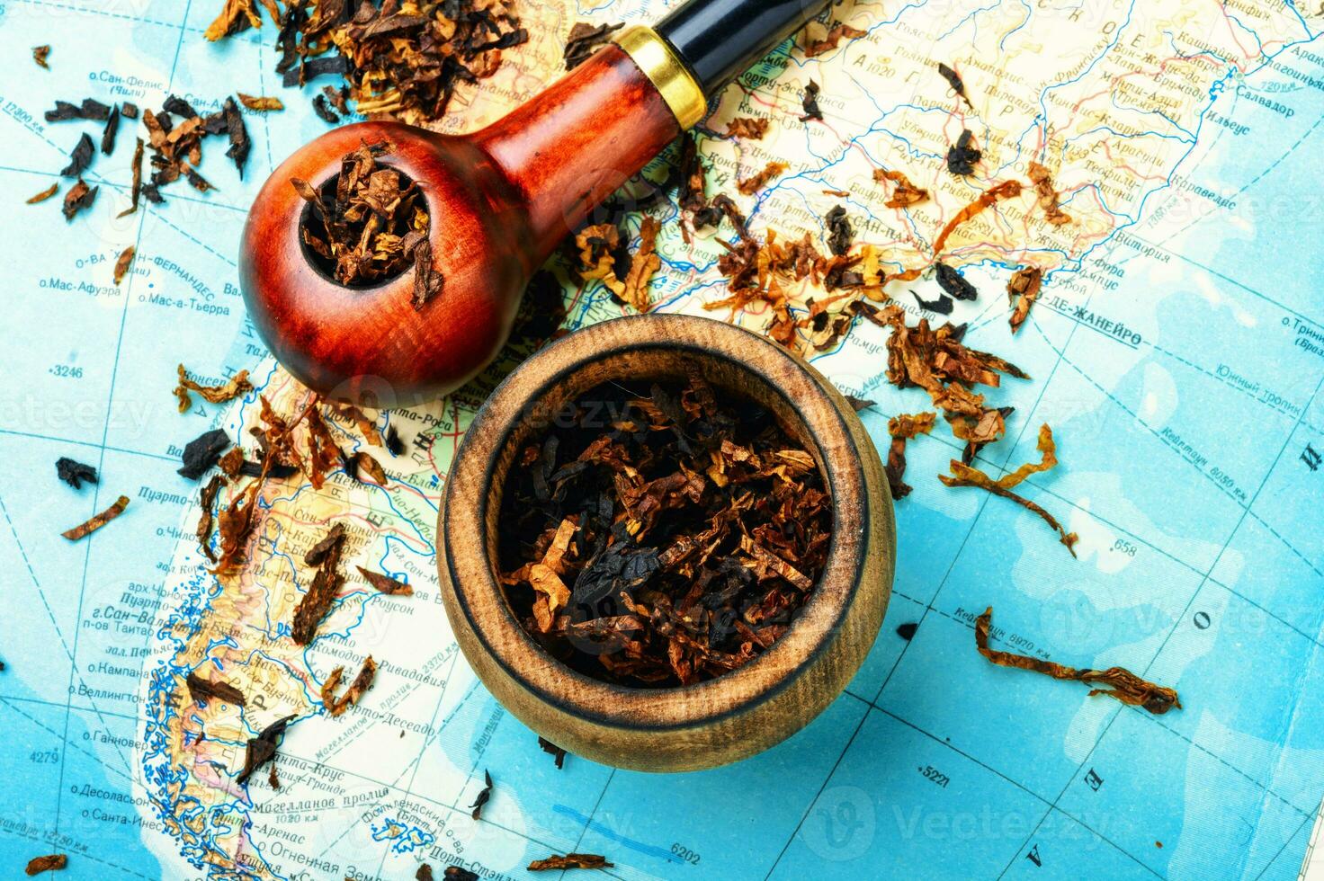 Tobacco pipe on the map photo