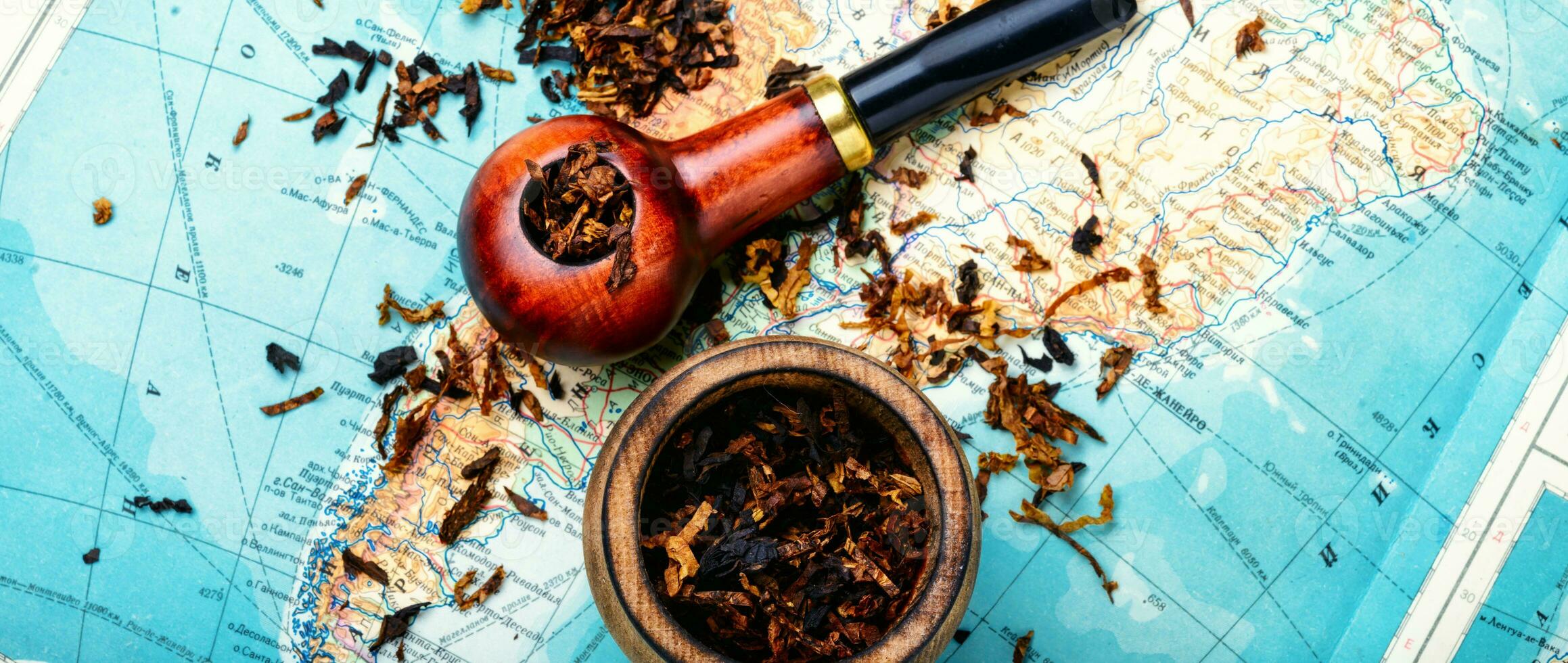 Tobacco pipe on the map photo