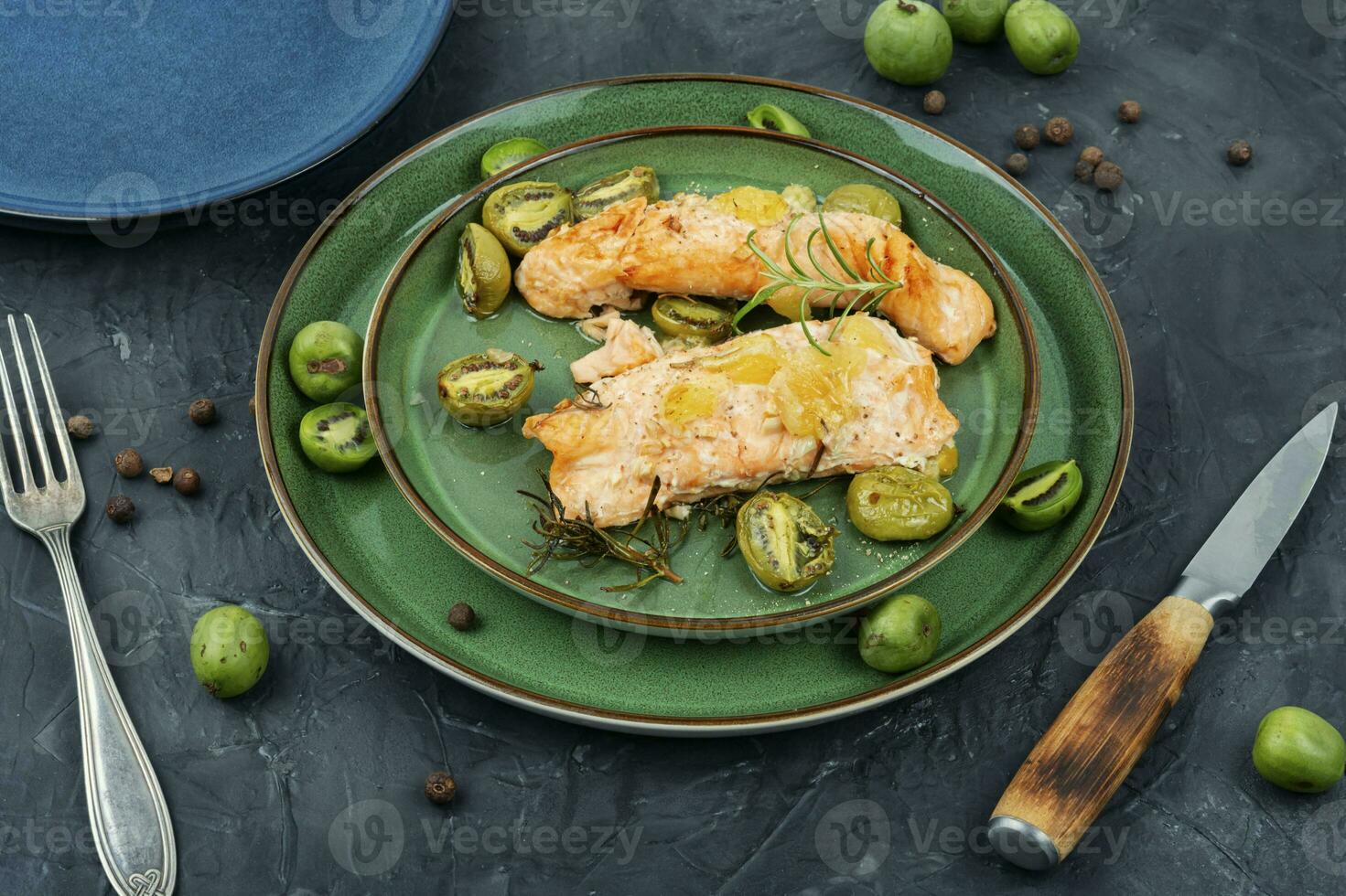 Baked salmon fillets with mini kiwi. photo