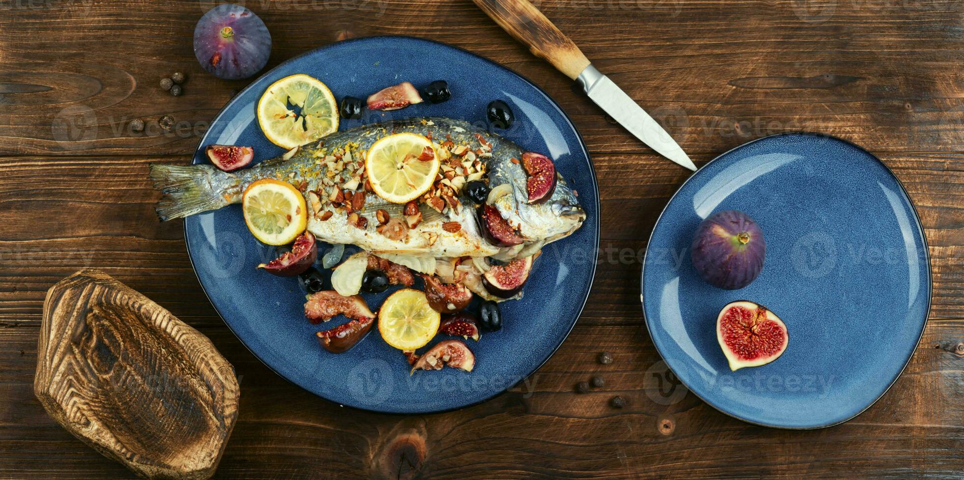 Baked sea bream dorada fish with figs. photo