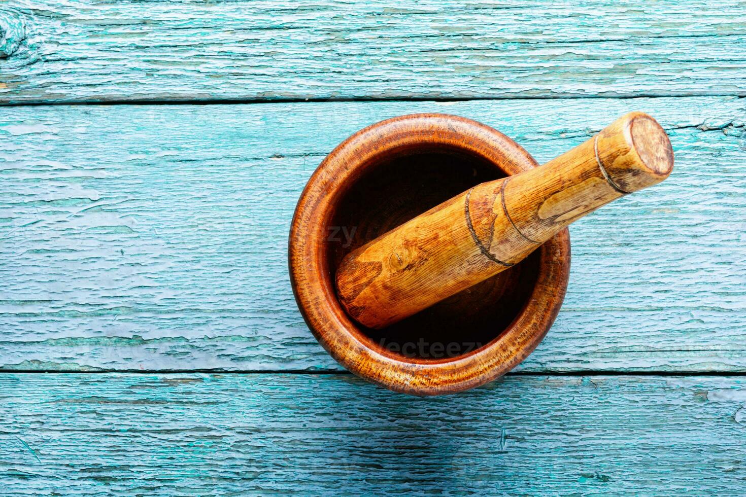 Empty wooden mortar photo