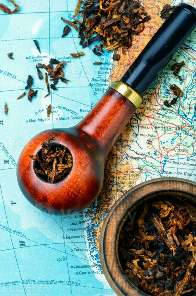 Tobacco pipe on the map photo