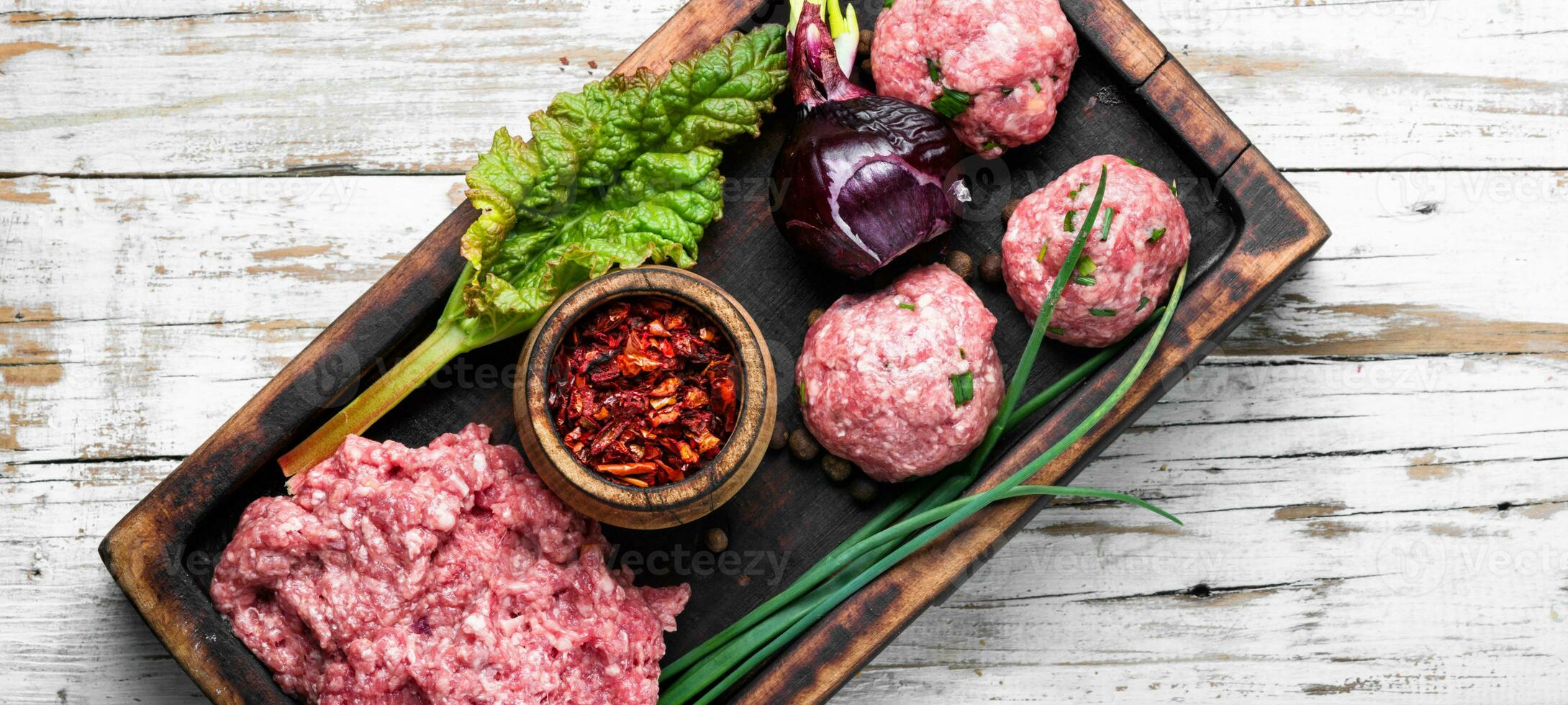 Raw uncooked meatballs photo