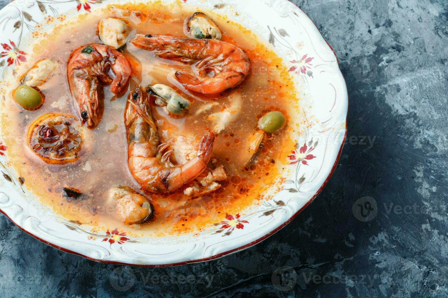 Spicy soup with seafood photo