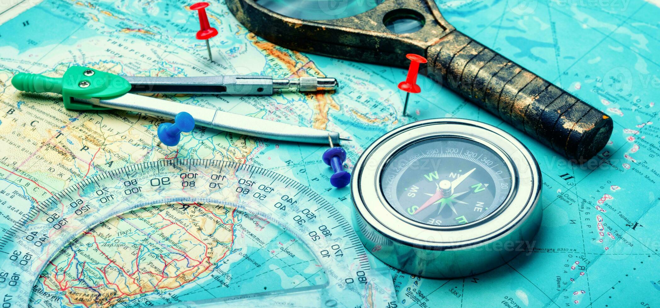 Old compass on vintage map photo