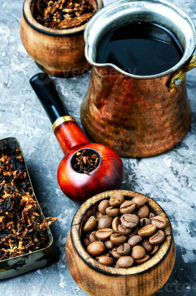 Smoking pipe and coffee photo