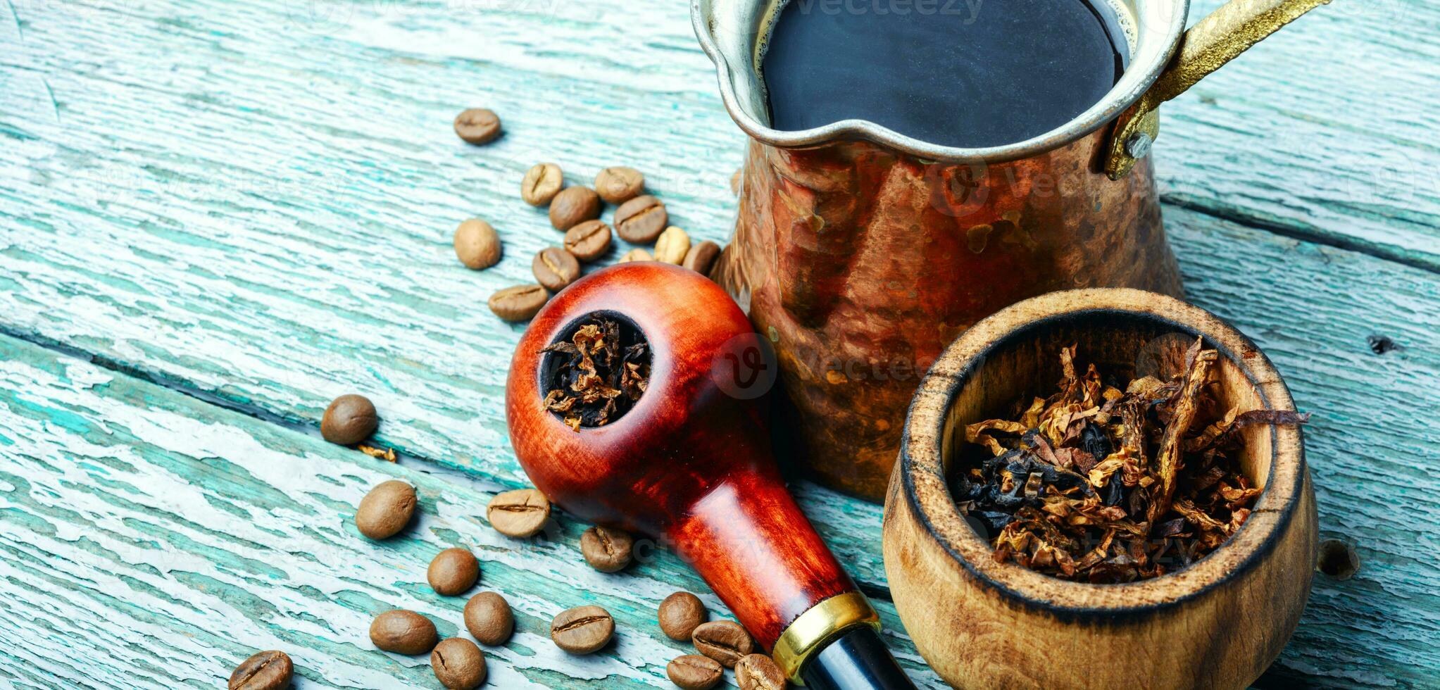 Smoking pipe and coffee photo