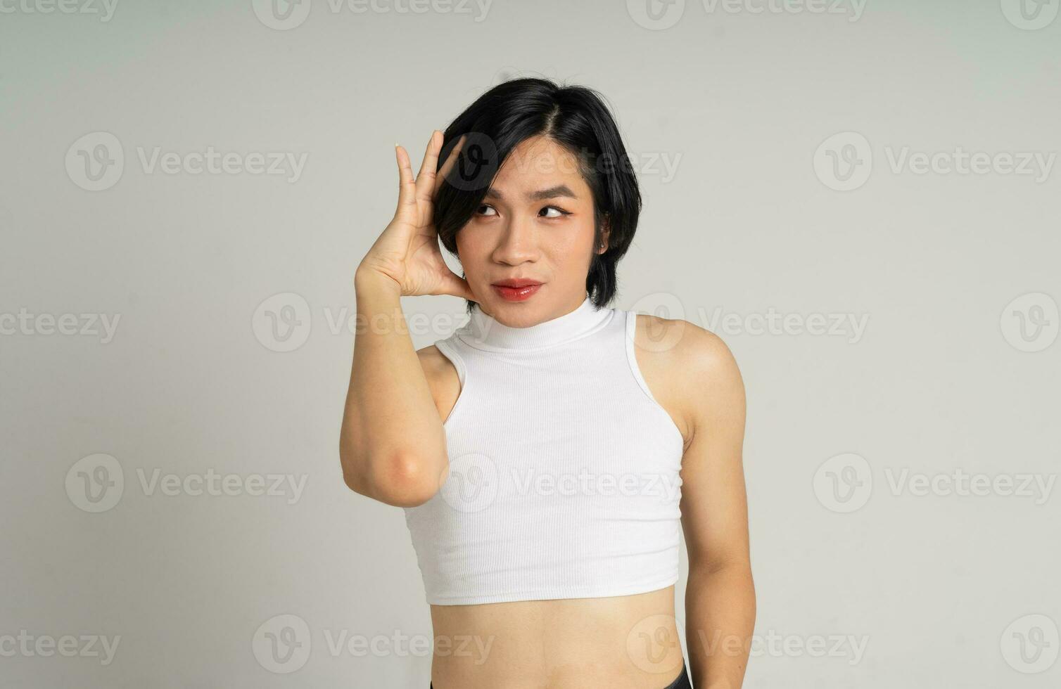 Portrait of gay man confidently posing on background photo