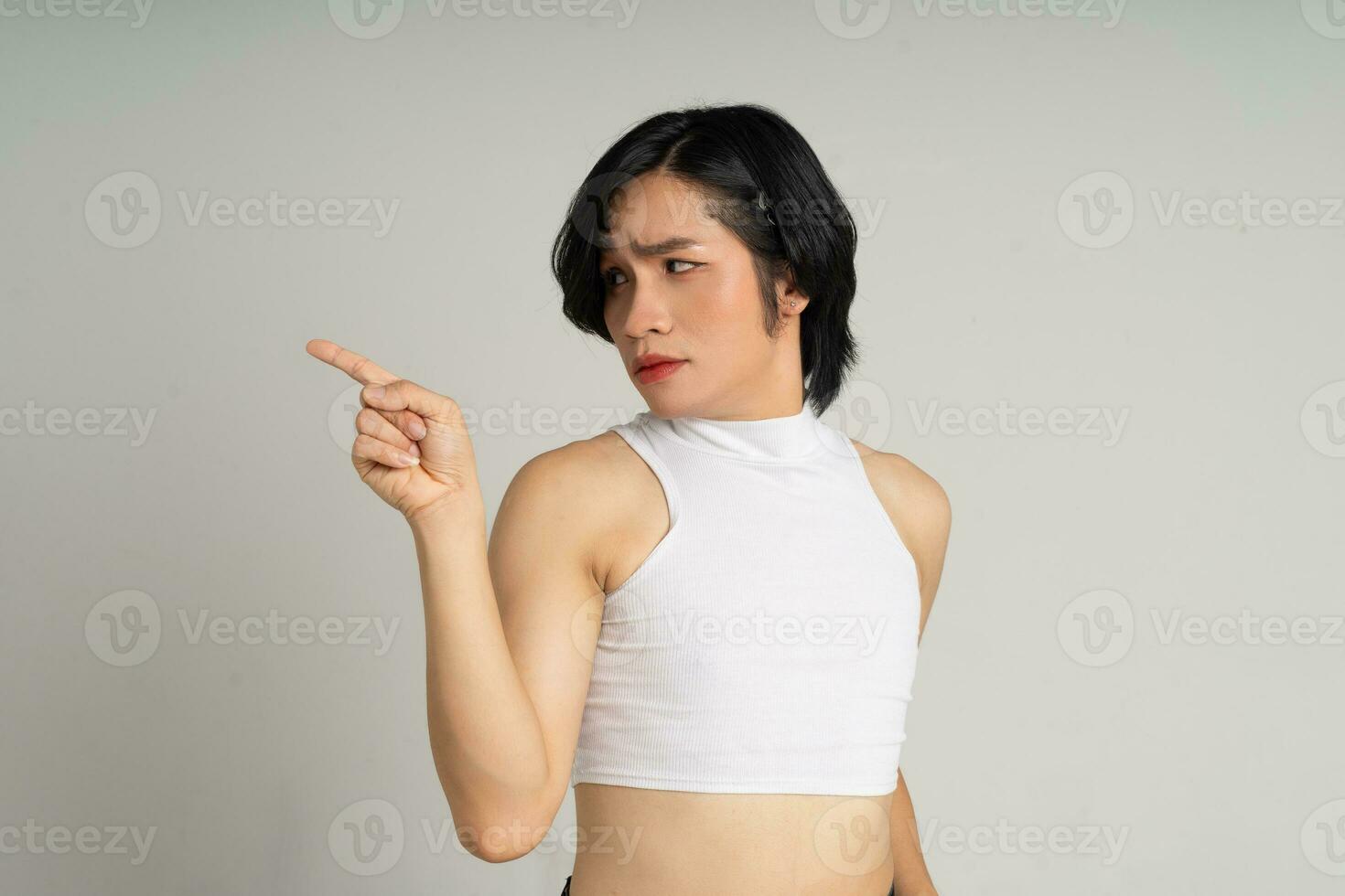 Portrait of gay man confidently posing on background photo