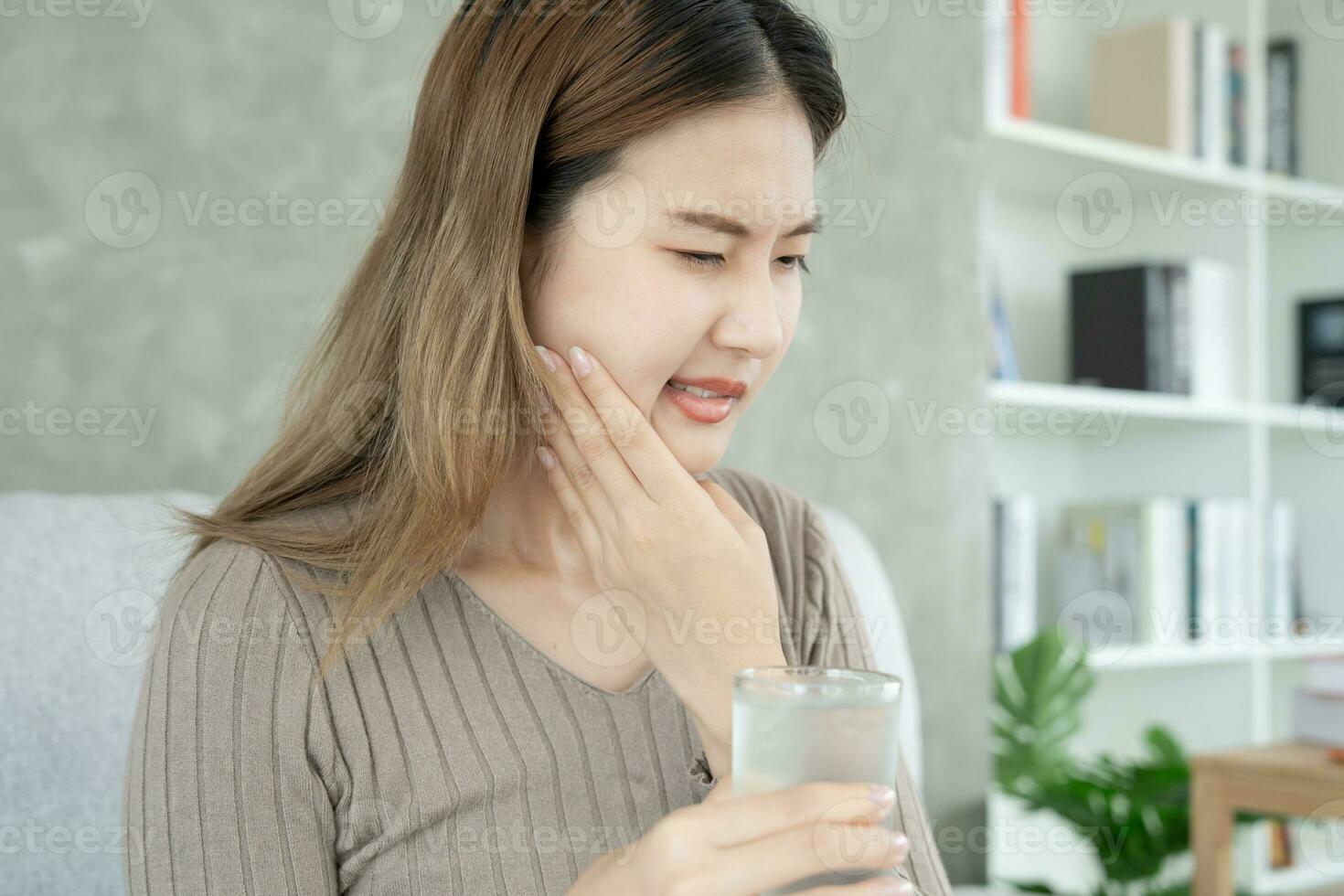 Asian woman feel sensitive teeth after drinking cold, female suffer tooth, decay problems, dental care, tooth extraction, decay problem, bad breath, Gingival Recession, Oral Hygiene instruction photo