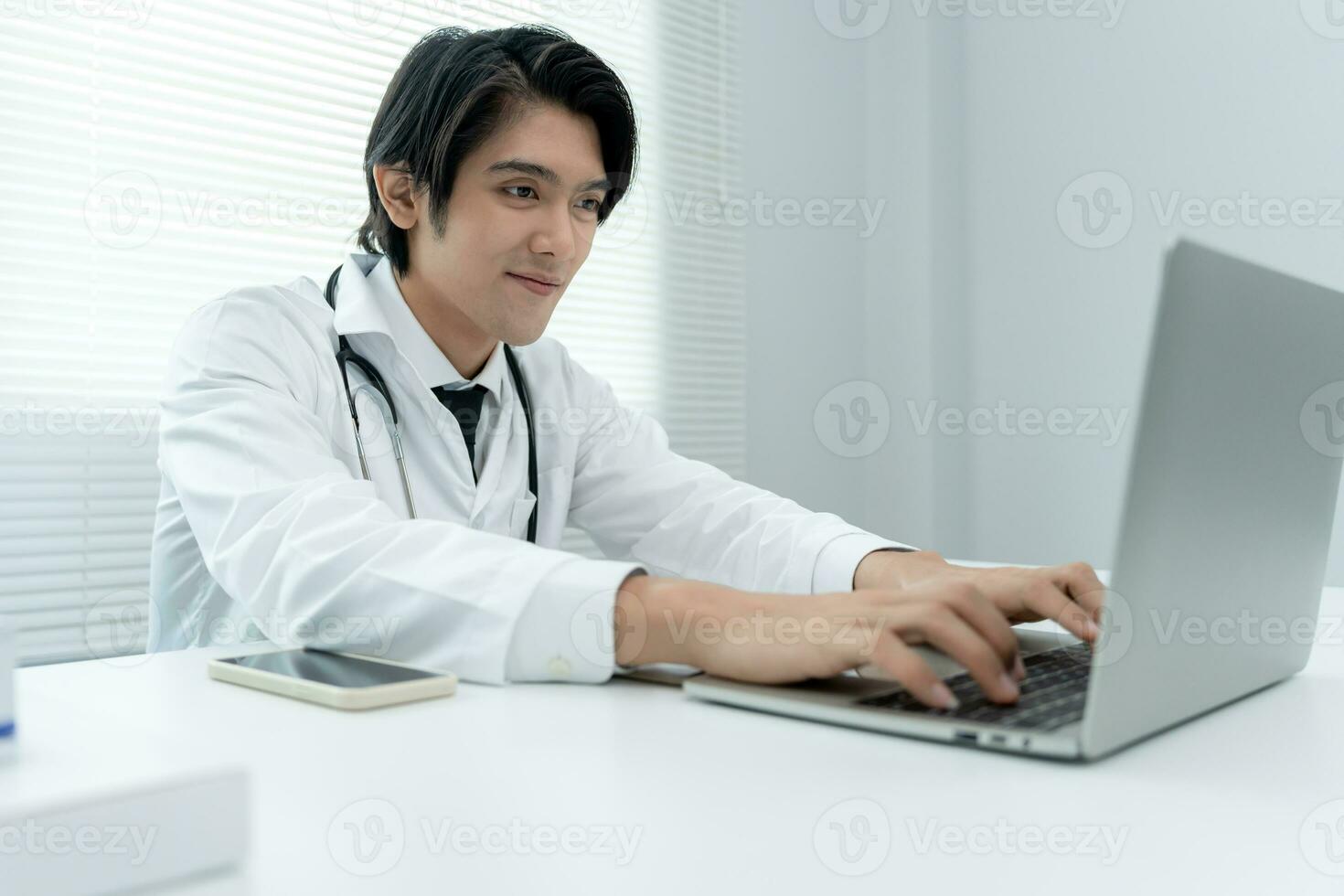 telemedical. Doctors are advising patients over the Internet by video conference. Asian doctor is treating patients through telecommunication while describing the disease . Technology for health. photo