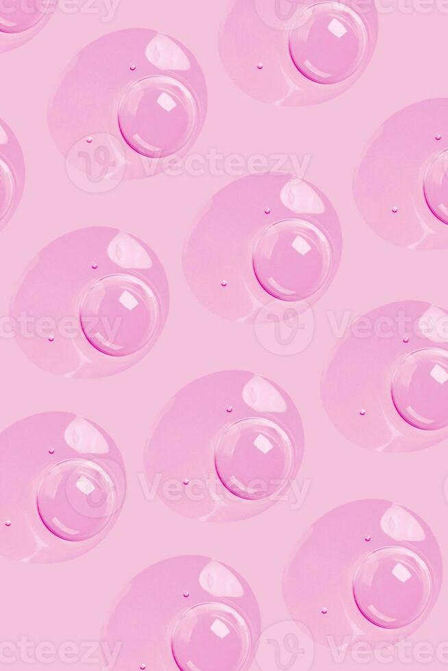 a pink background with many bubbles on it photo