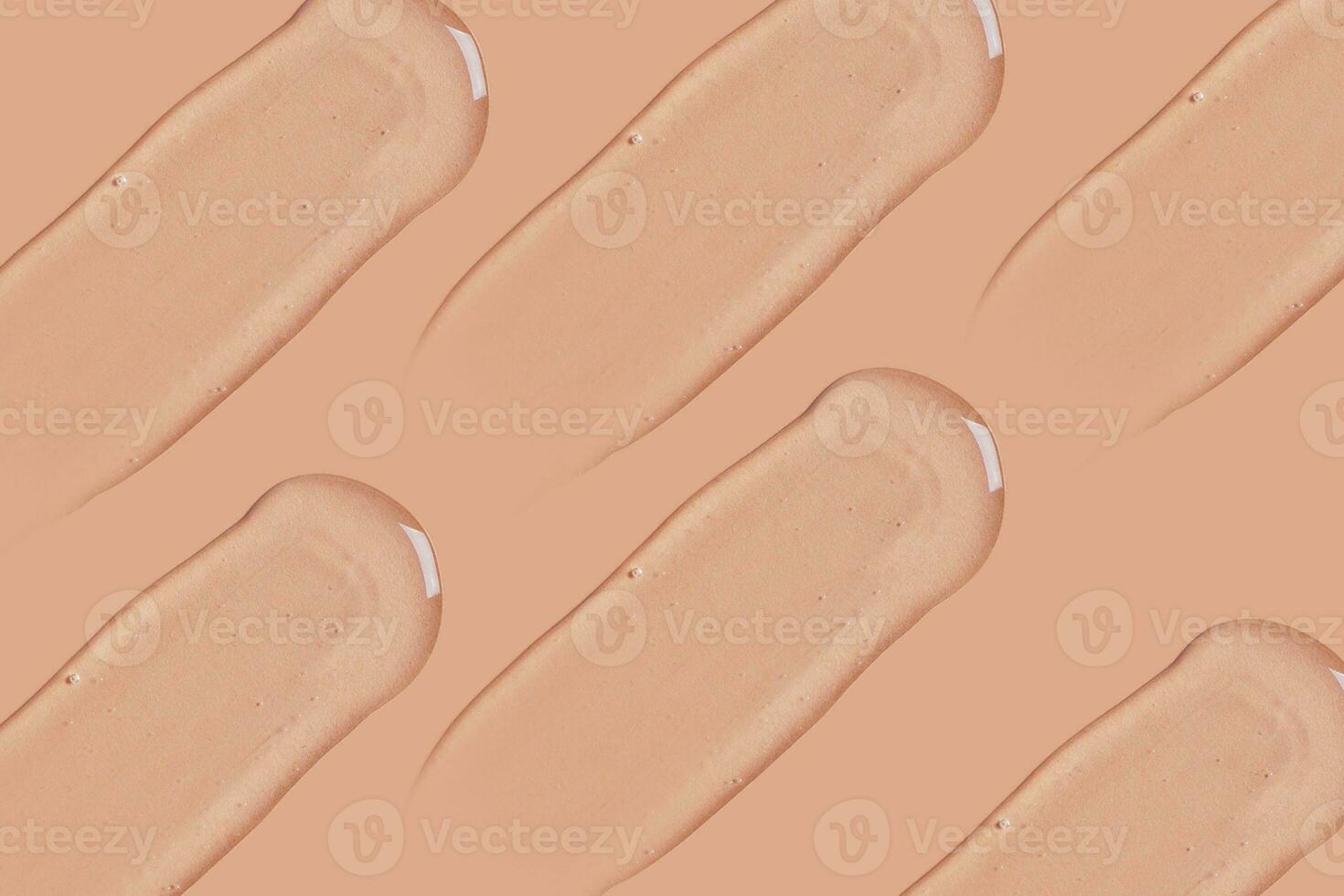 transparent cosmetic gel smeared on a beige background photo