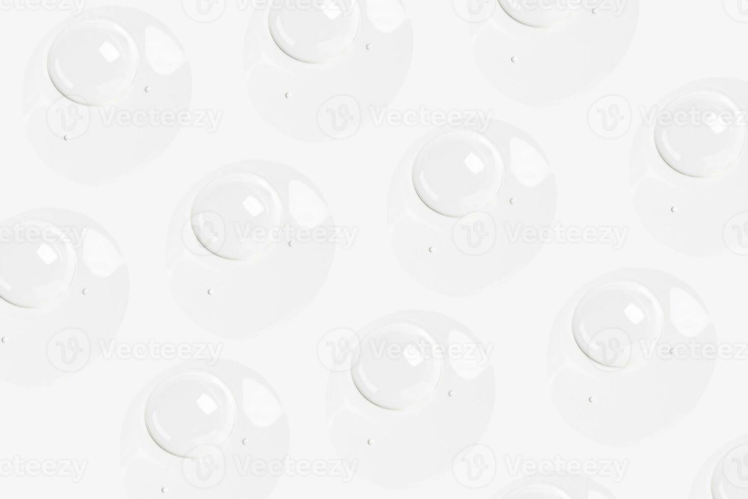 drops of transparent gel on a light background photo