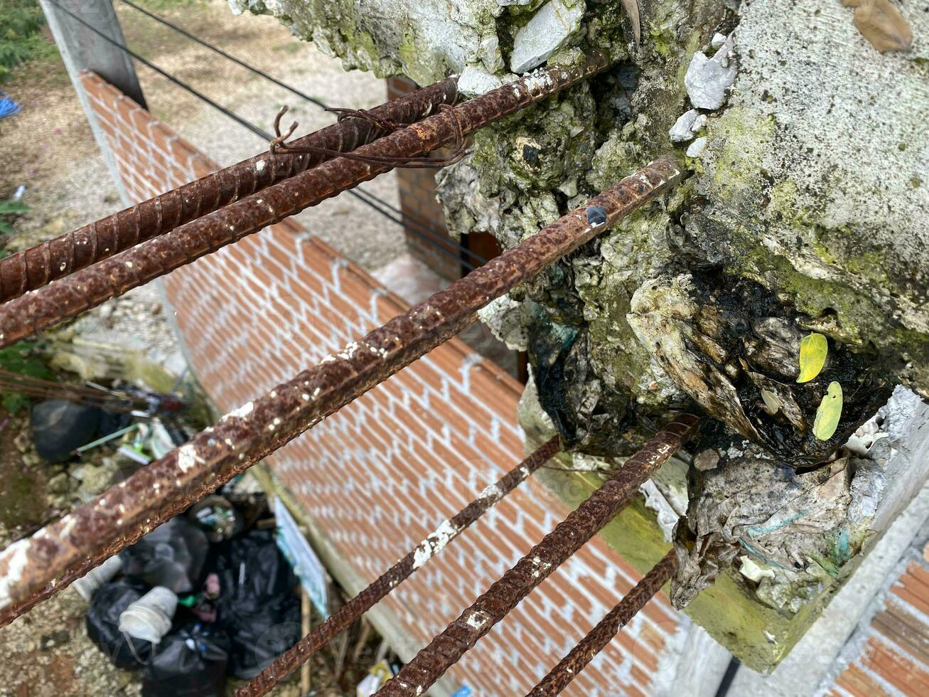 rusty Reinforcement steel rod and deformed bar with rebar at construction site. concrete beam in construction site. closeup rebar show detail and rusty of construction no people. photo