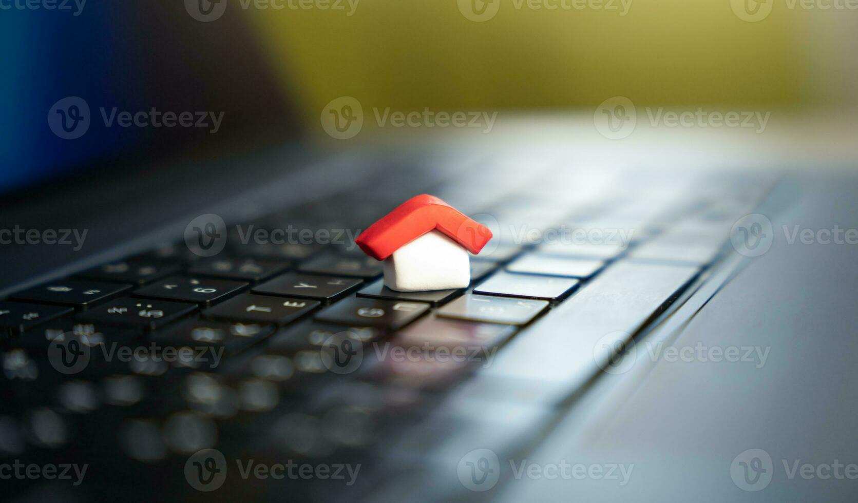 House on a computer keyboard. Paying bills online. House and utilities. Electricity, heating, water and gas. Energy efficiency. Electronic documentation in registers. Registration of property. photo