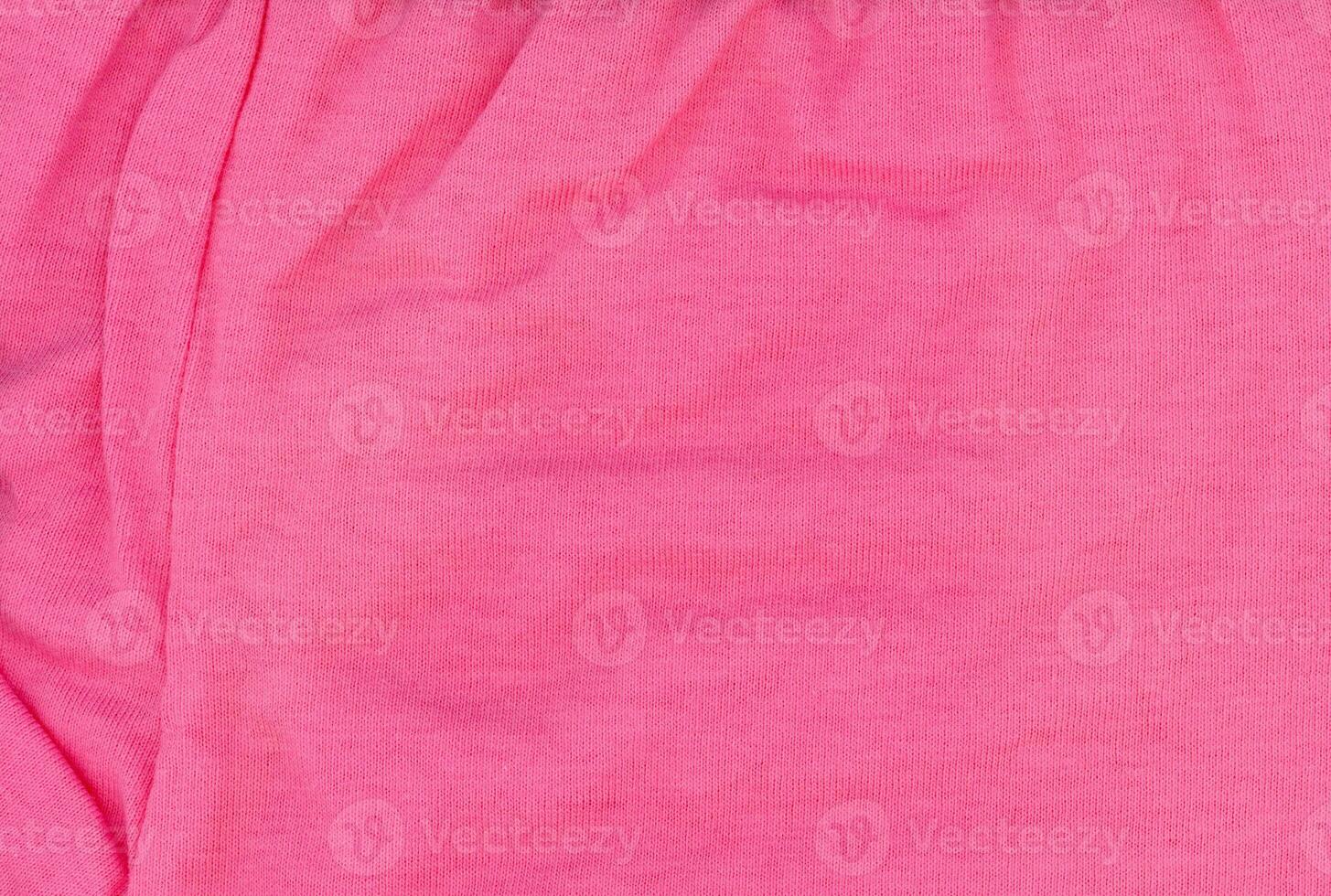rippled pink fabric texture background photo