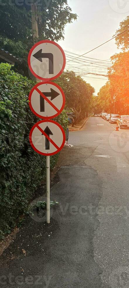 Traffic signs Do not turn right, do not go straight, turn left. photo