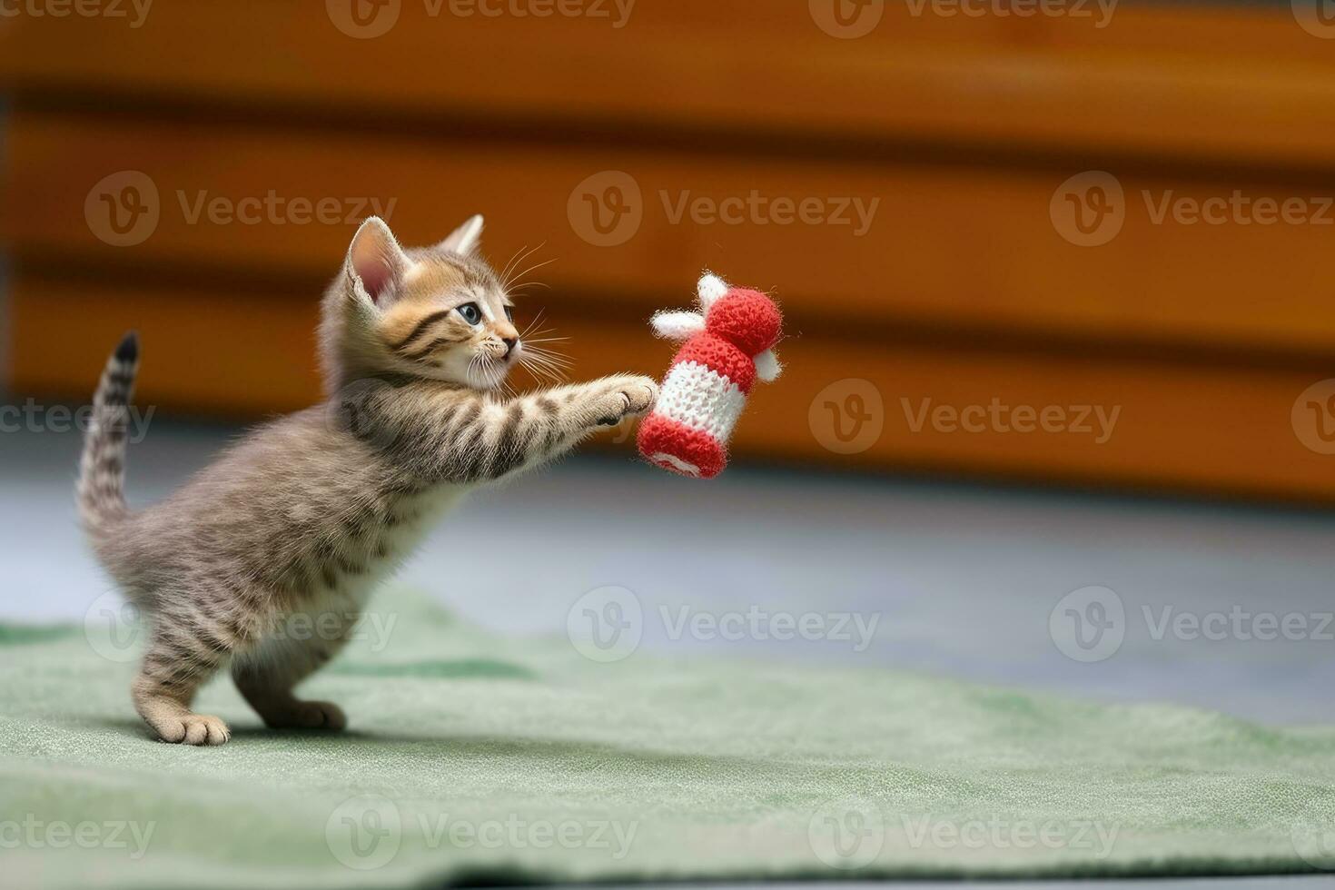 Playful Kitten Chasing Toy Mouse in Action Shot with Blurred Background - Indoor Pet Photography - AI generated photo