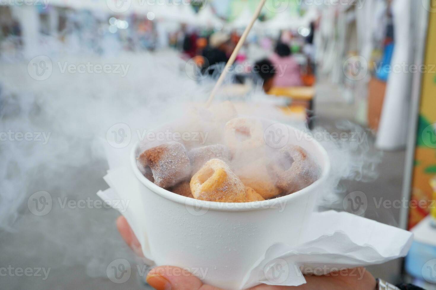 Ice smoke snacks in Indonesia are called ciki ngebul. Children's snacks given liquid nitrogen are dangerous to health photo