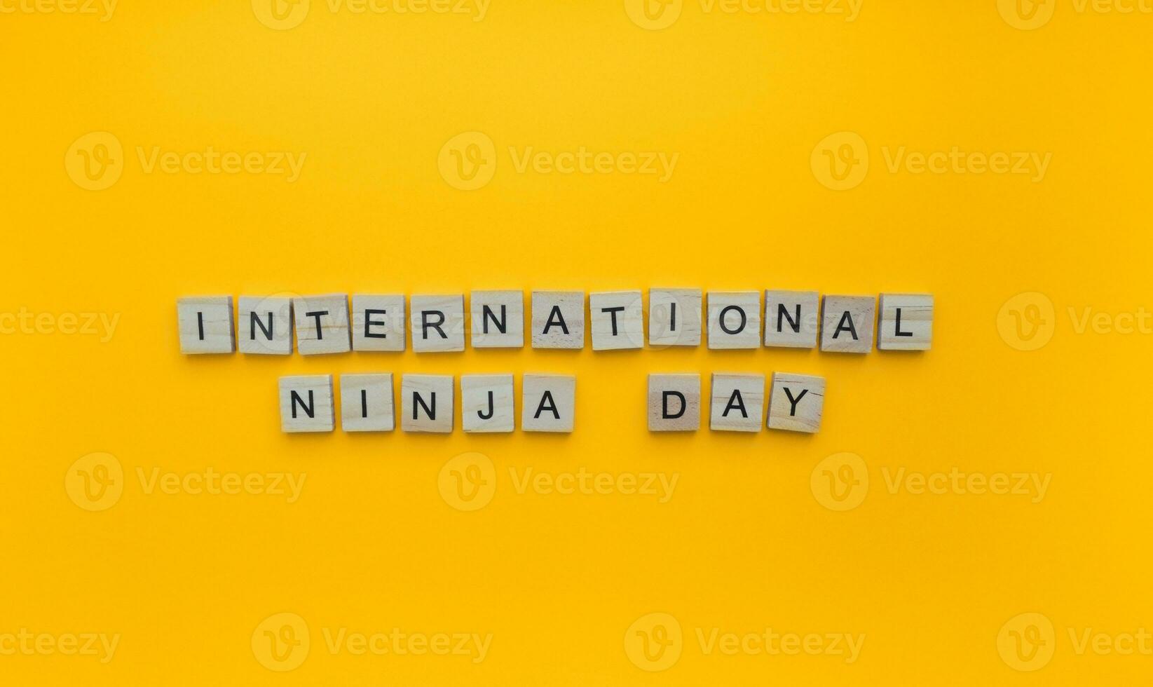 December 5, Ninja day, minimalistic banner with the inscription in wooden letters photo