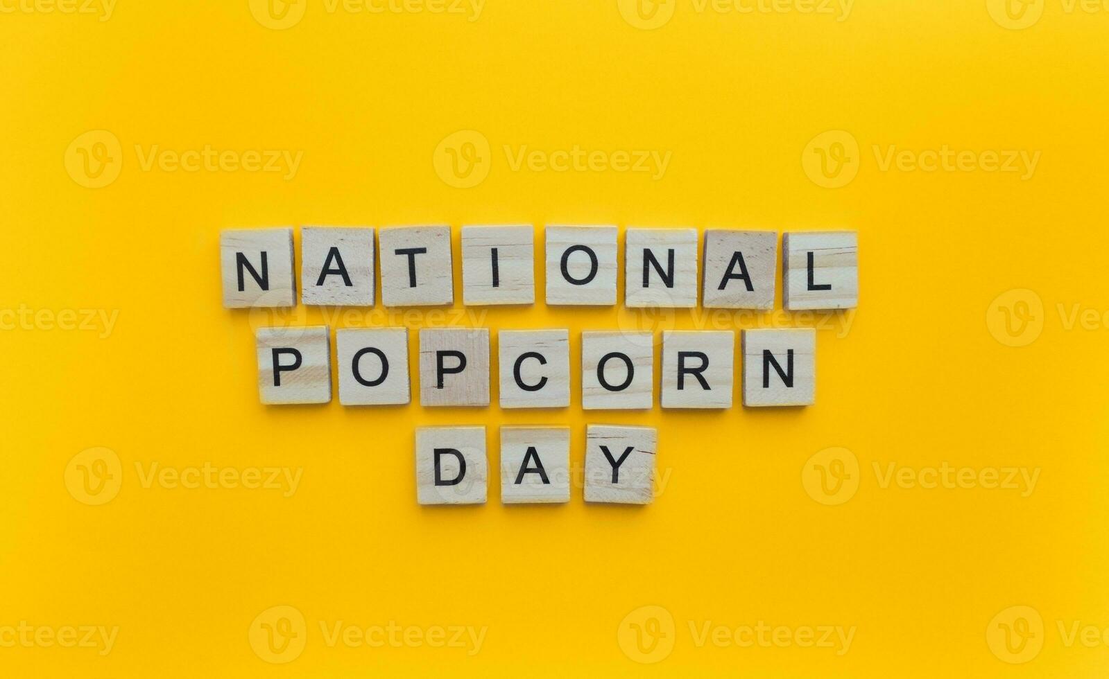 January 19, National Popcorn Day, minimalistic banner with the inscription in wooden letters photo