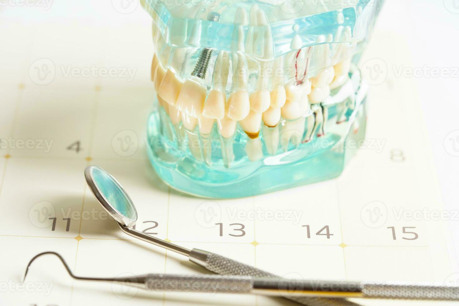 Dental appointment reminder in calendar, healthy teeth, dental health care. photo