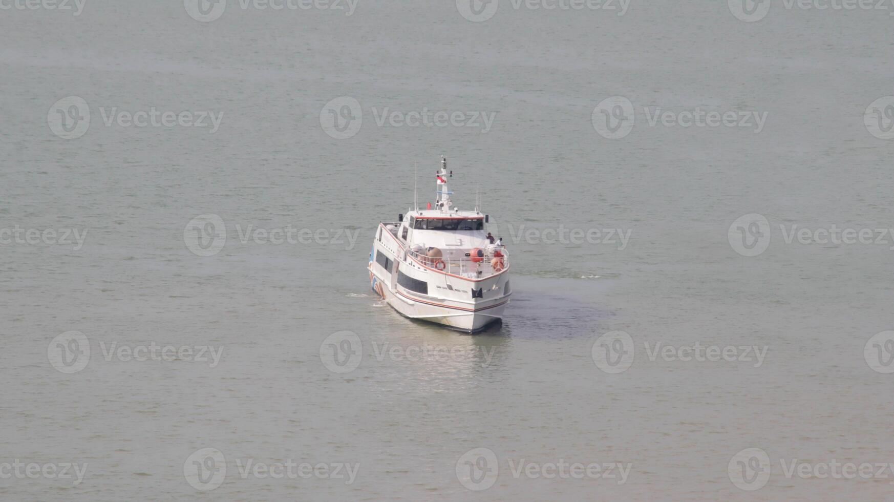 Fast ferry passenger vessel ship transportation sail at the sea. photo