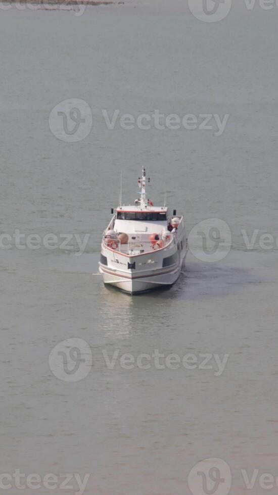 Fast ferry passenger vessel ship transportation sail at the sea. photo