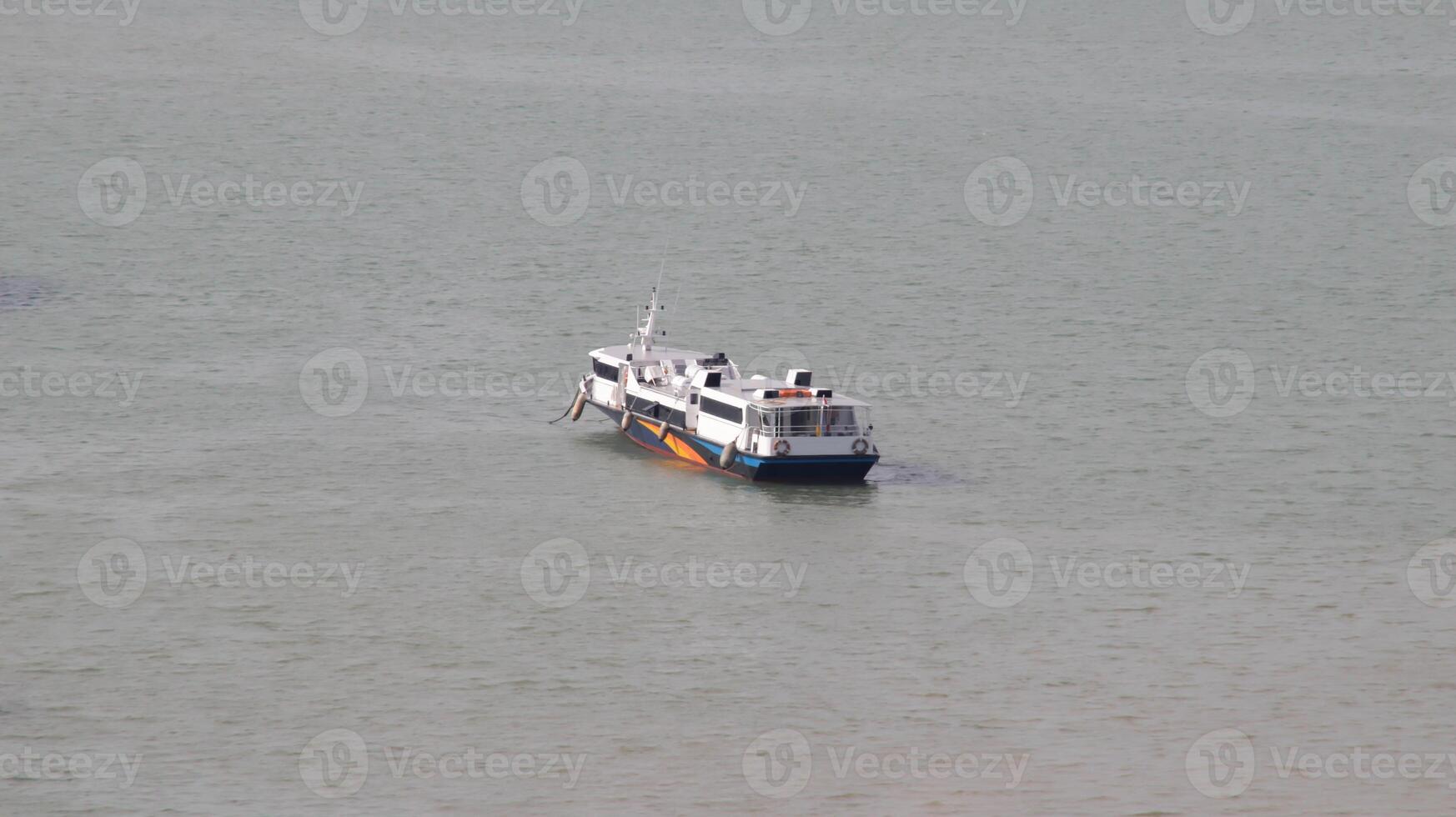 Fast ferry passenger vessel ship transportation sail at the sea. photo