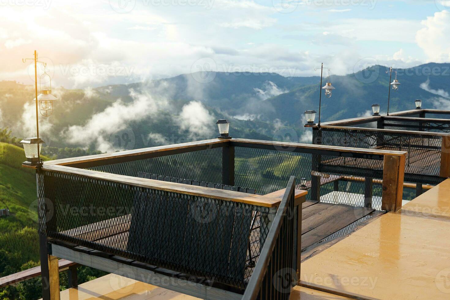 A steel balcony extends from the front of the room for viewing the high mountain peaks and mist during the rainy season in northern Thailand. photo