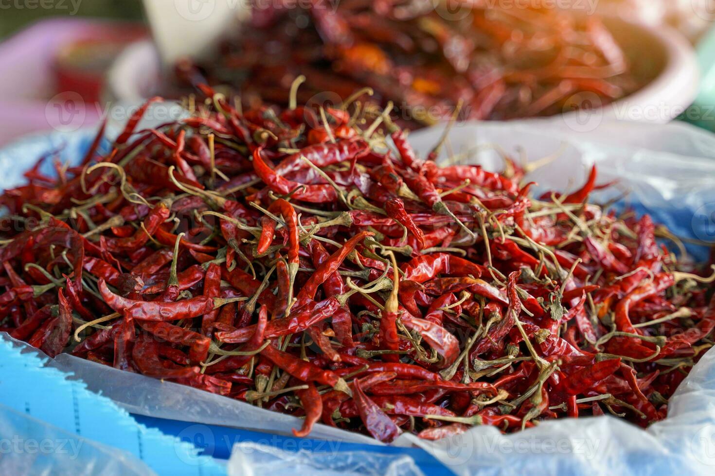 dried chilies in basket are herbal plants, a flavoring in processed foods derived from fresh chilies. Spicy taste Popularly used as an ingredient in curry paste or dried into chili powder. photo