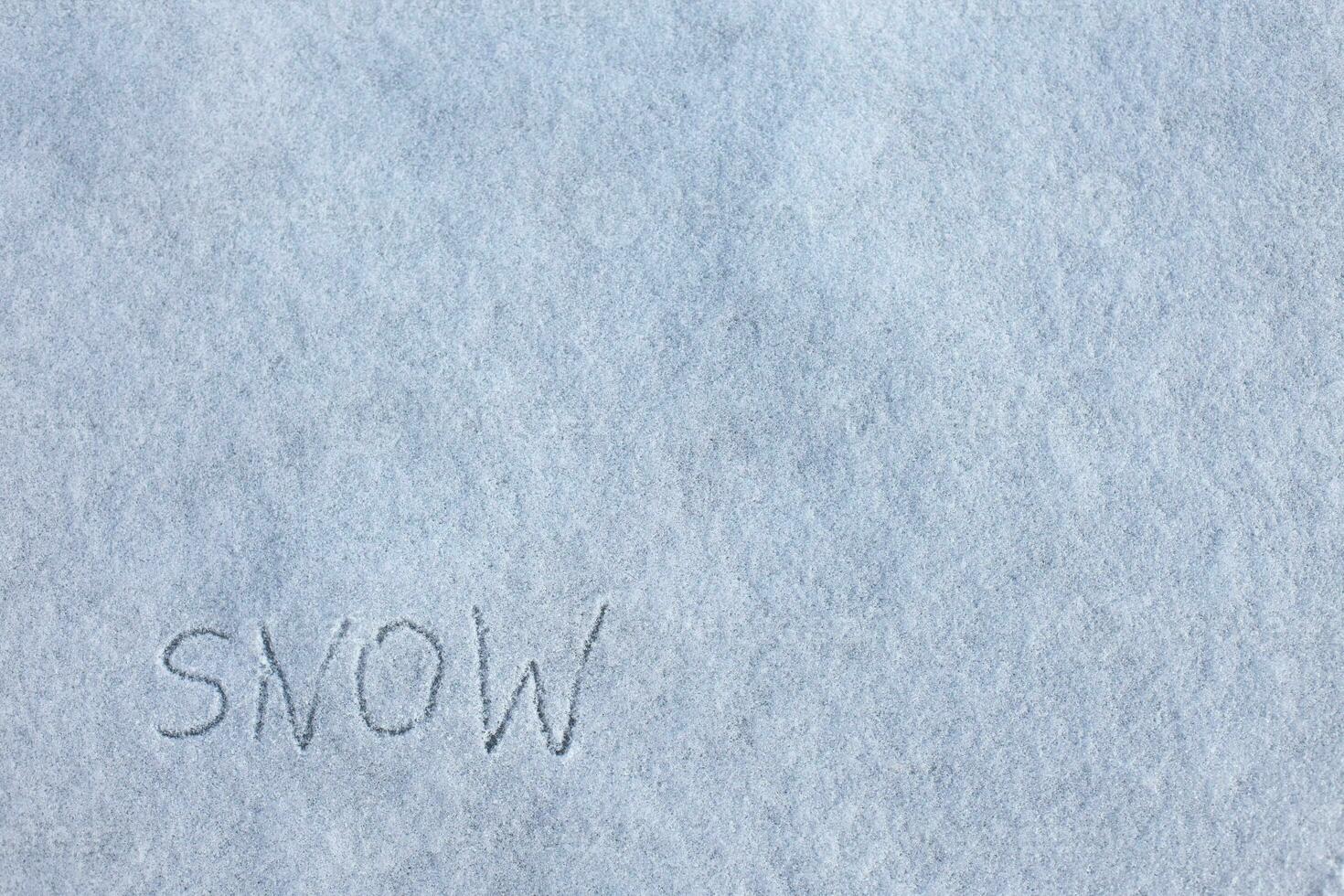 Snowy background. inscription snow on snow. photo