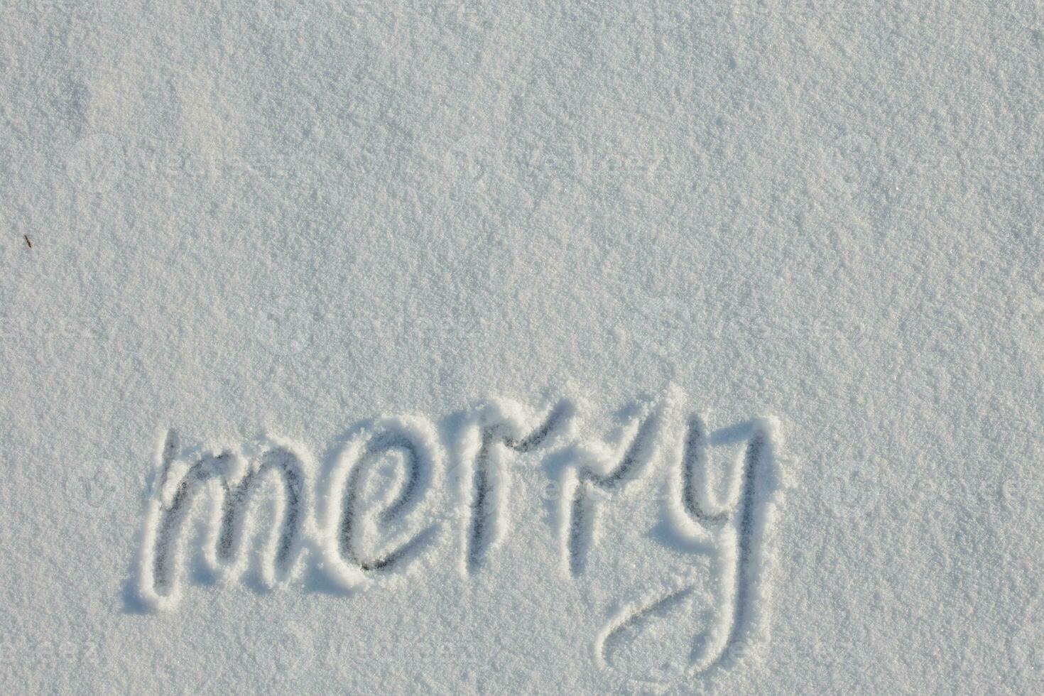 Snow-covered lake. Snow cover. text merry written with finger photo