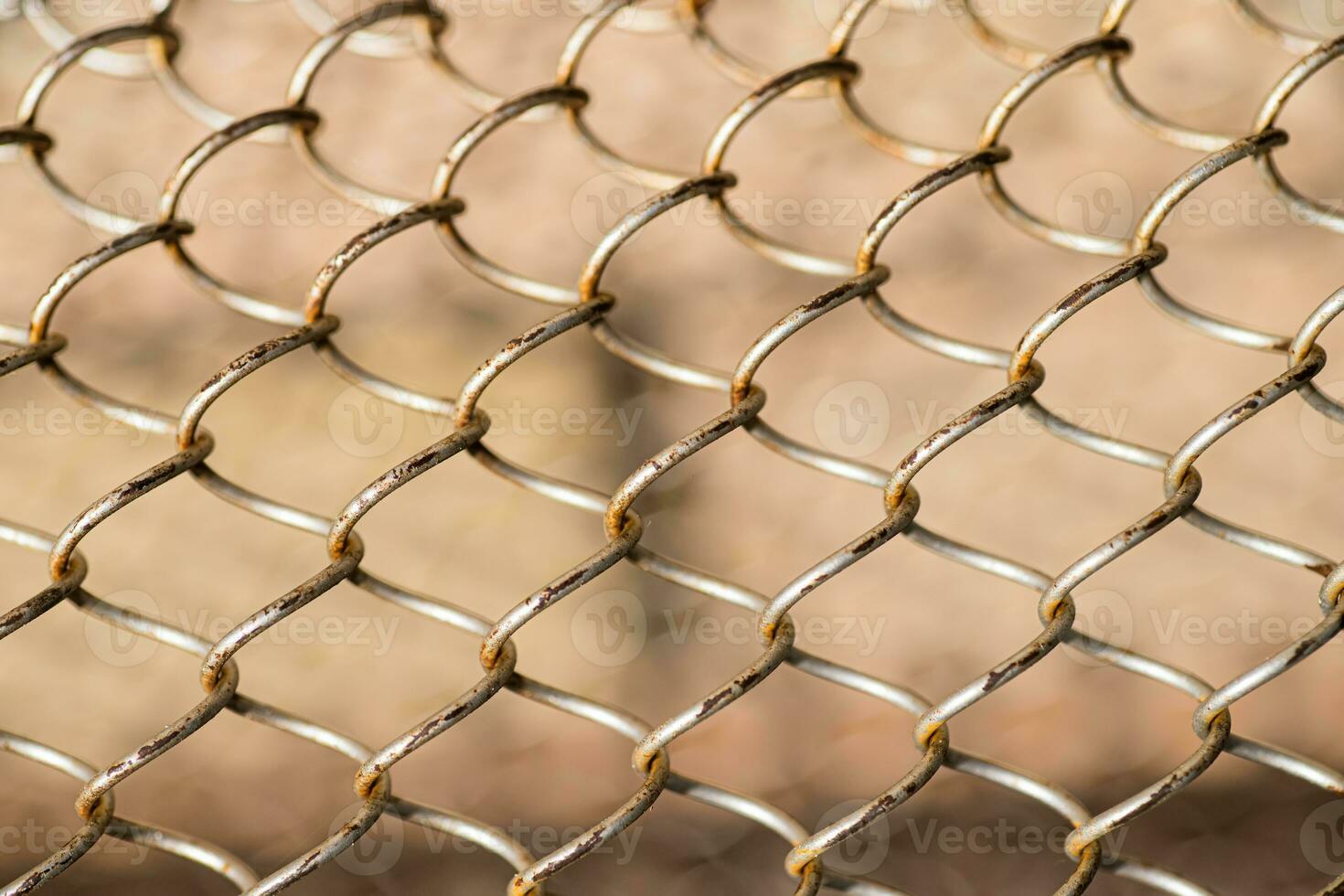 Mesh rabitz , texture of weaving mesh network link. Close up of a fence. barrier on way. metal grid close-up. rusty mesh texture photo