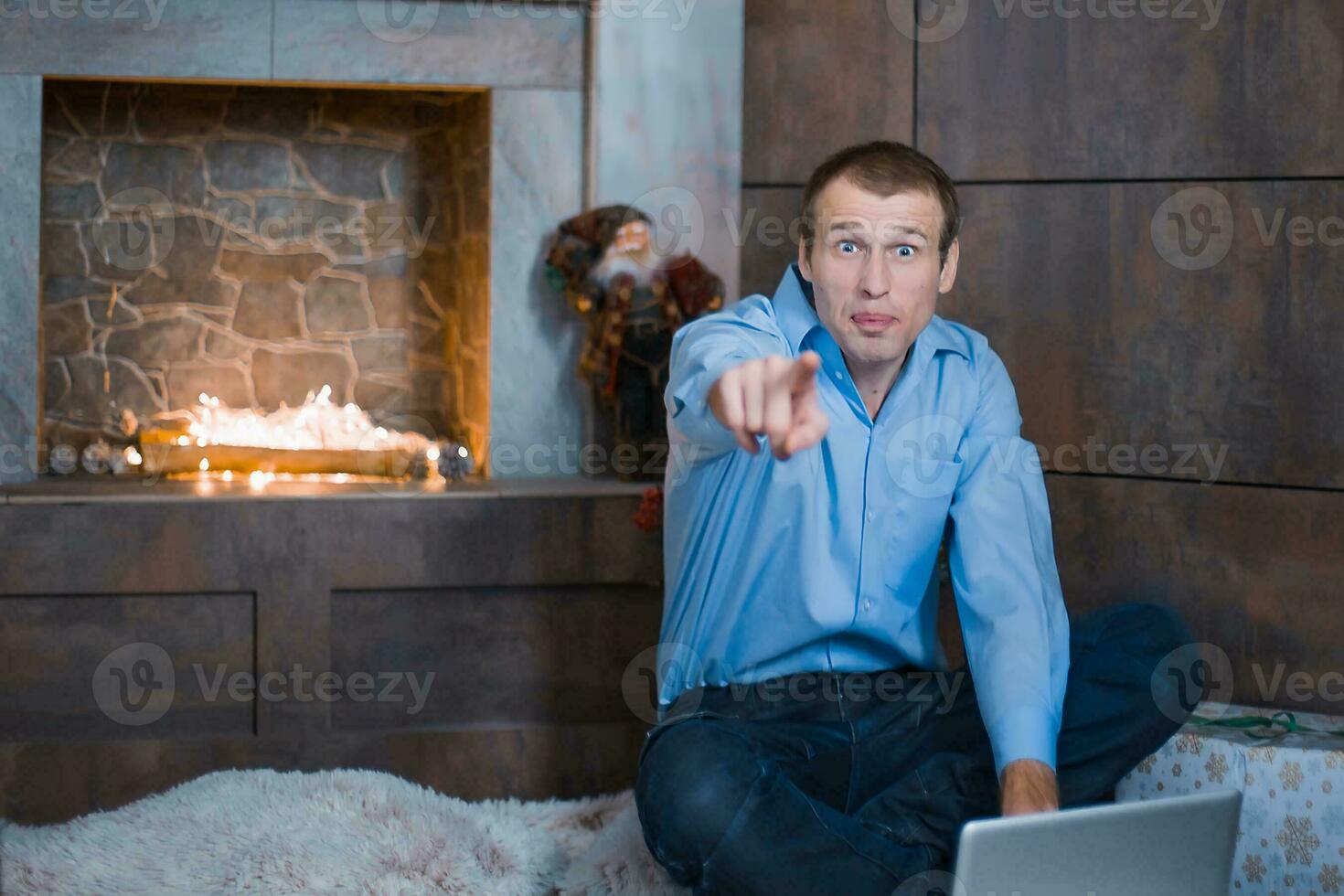 man shows the finger forward. photo