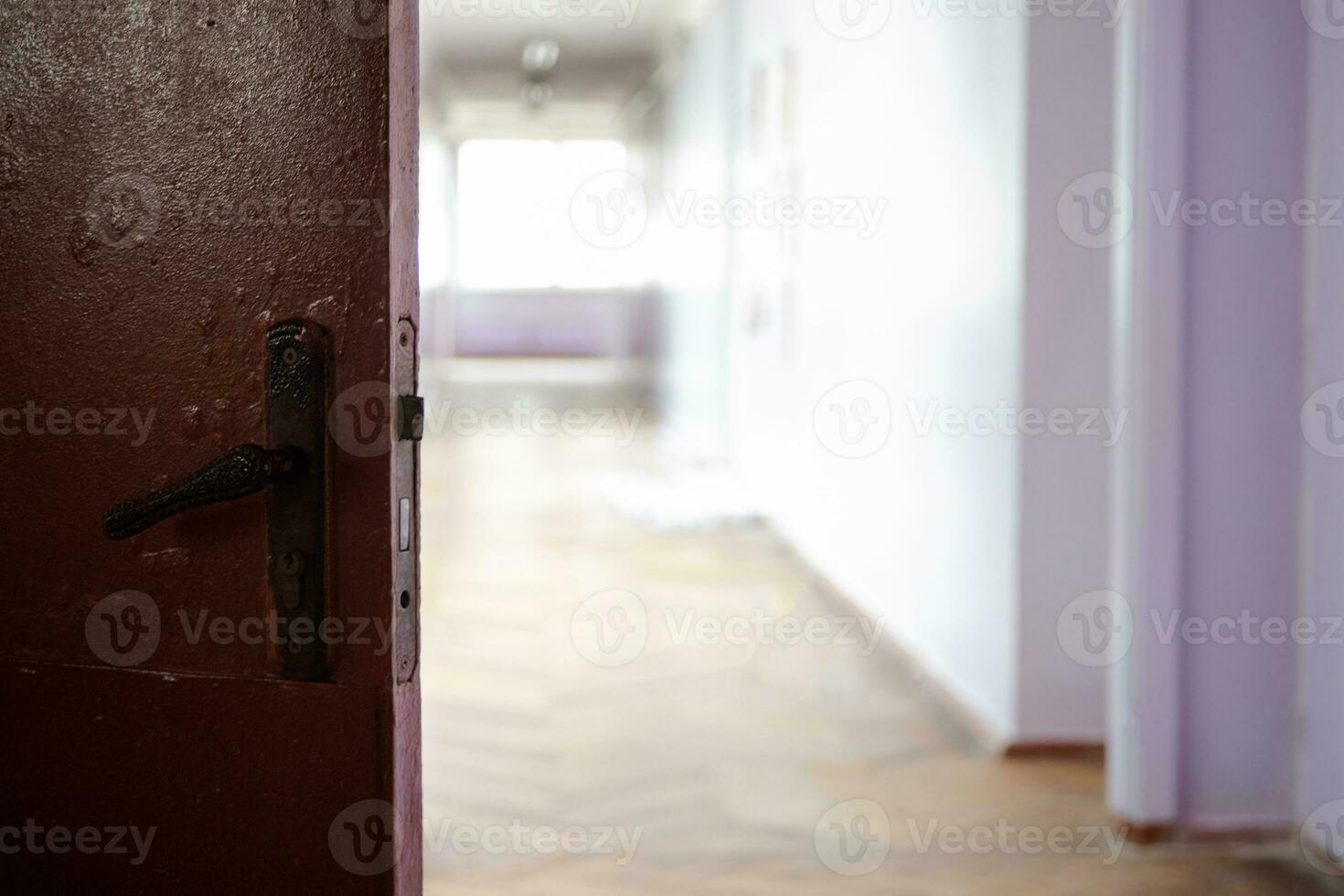 open dark door against light empty corridor of school. Ukrainian School during coronavirus quarantine. place for text. Copy space. school, education and learning concept photo