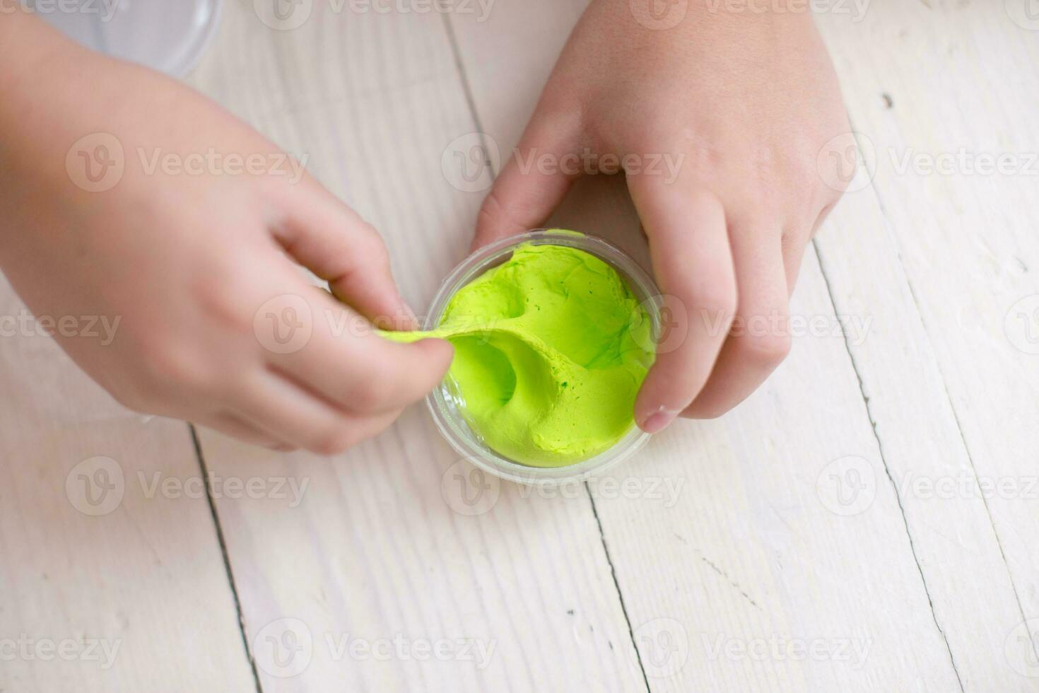Children mold homemade from stiffening clay. Fun in the winter in cold weather at home. Simple figures from plasticine do it yourself. photo