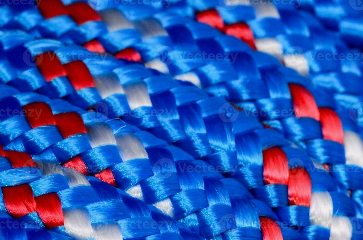 close up of blue, red and white braided rope photo