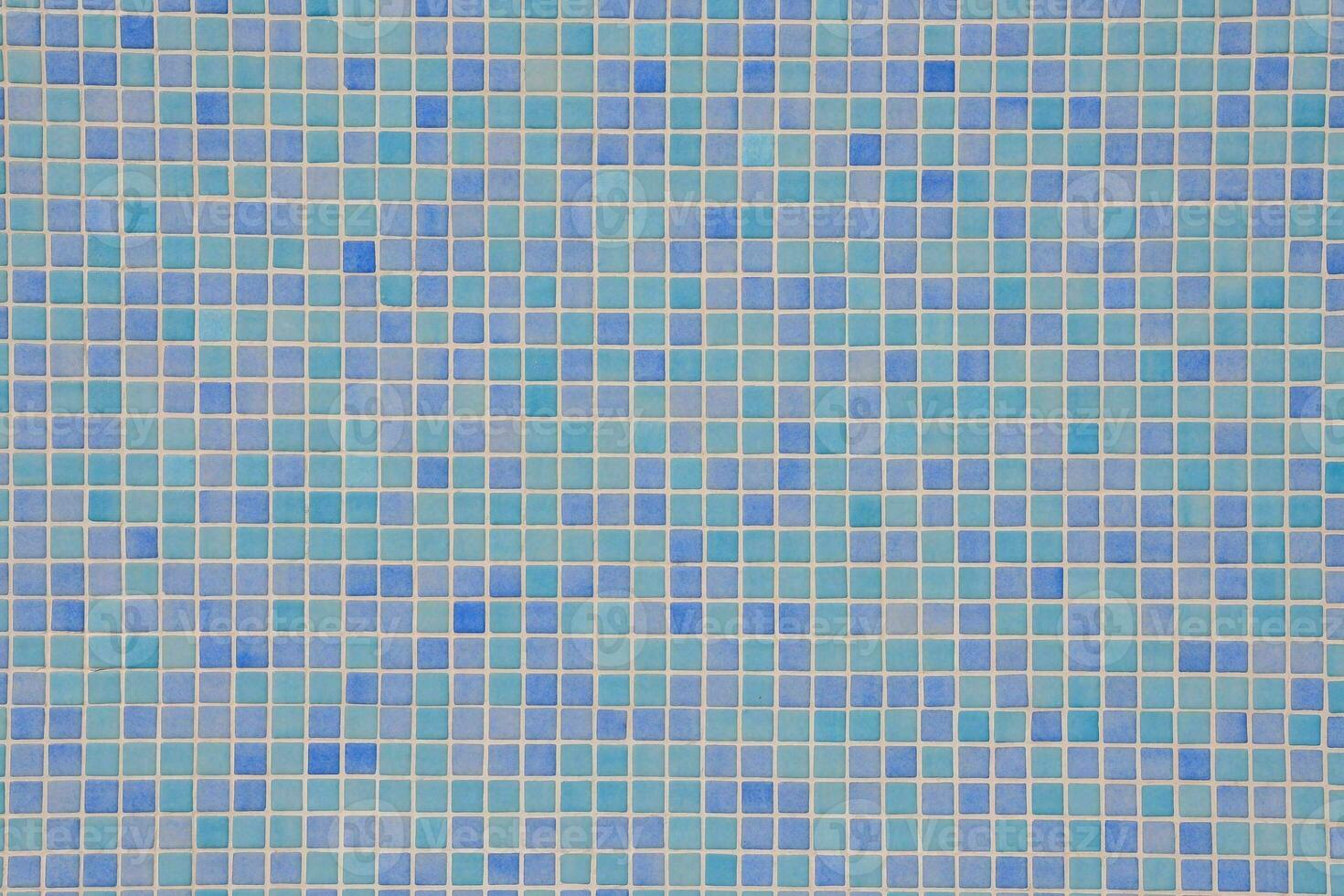 a blue and white mosaic tile wall photo